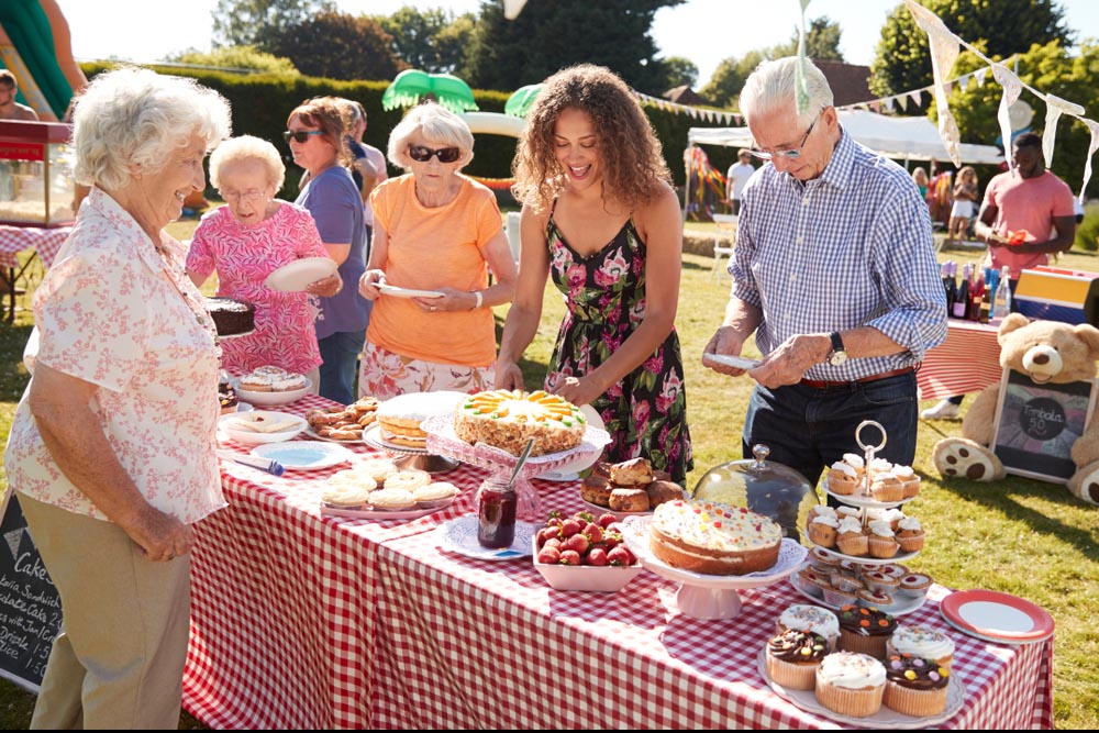 Busy,Cake,Stall,At,Summer,Garden,Fete